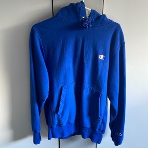 Blue champion hoodie, sized mens small.
